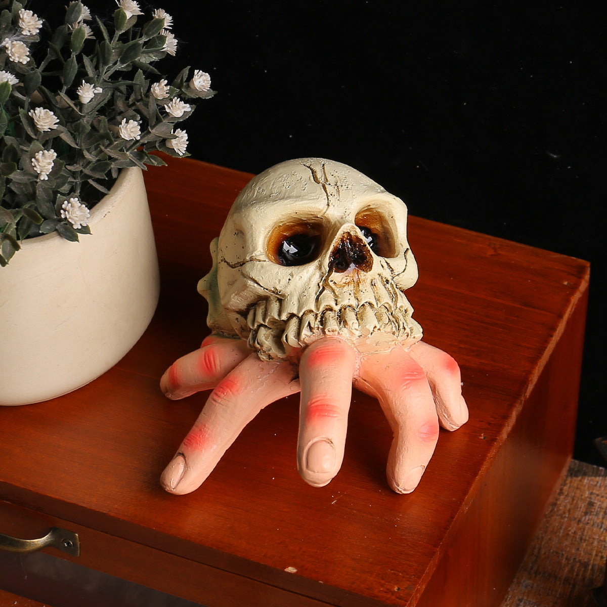 Skull Simulated Hand Figurine