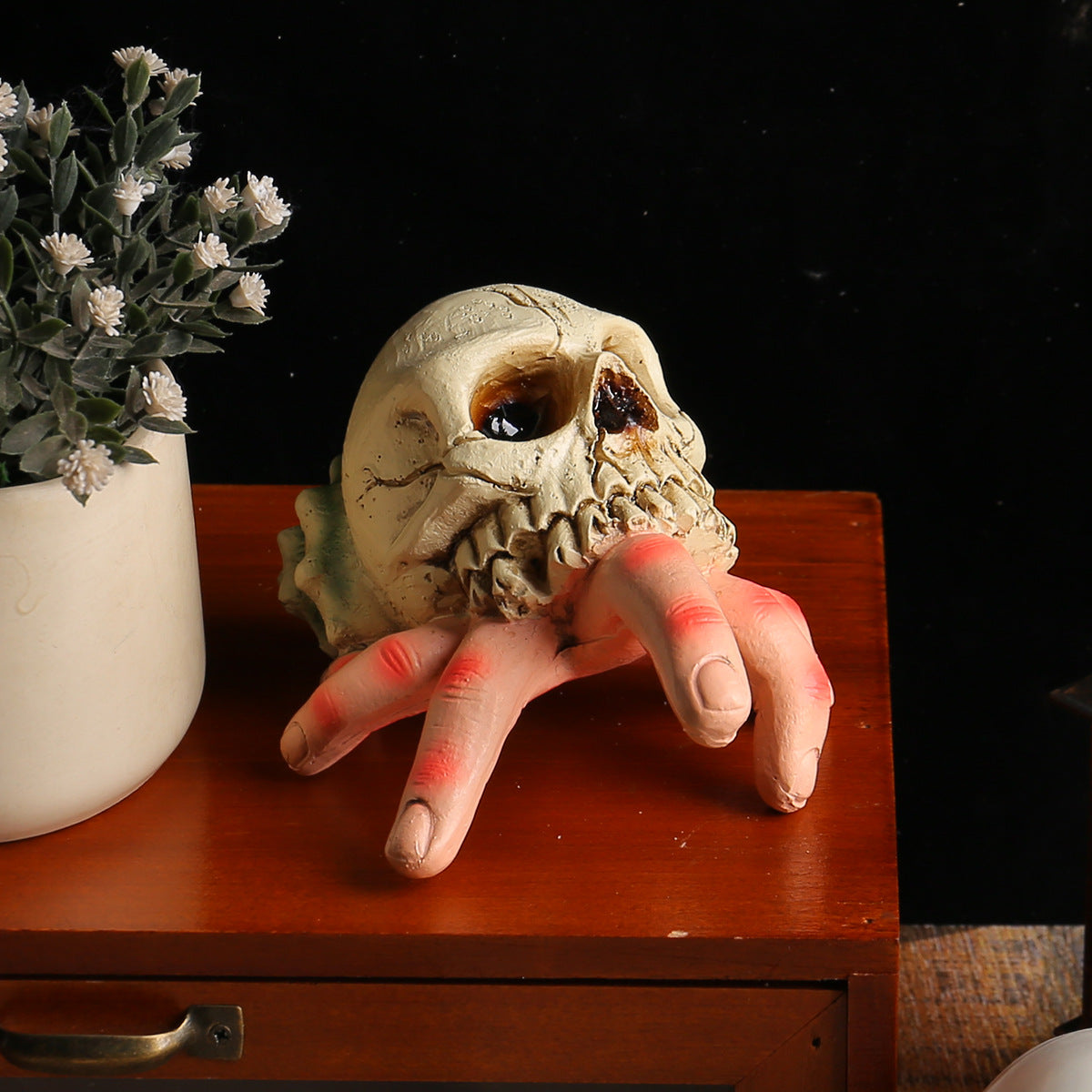 Skull Simulated Hand Figurine